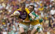 2 July 2006; Paddy Colfer, Wexford, in action against Scott Brady, Offaly. Bank of Ireland Leinster Senior Football Championship Semi-Final, Offaly v Wexford, Croke Park, Dublin. Picture credit: Pat Murphy / SPORTSFILE
