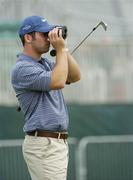 4 July 2006; Paul Casey, England, looks through binoculars on the driving range during the practise day in advance of the Kappa Smurfit European Open Golf Championship. K Club, Straffan, Co. Kildare. Picture credit: Damien Eagers / SPORTSFILE