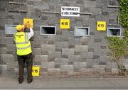 22 June 2014; Local official Michael Moloney nails on the admission price in advance of the game. Munster GAA Football Senior Championship, Semi-Final, Clare v Kerry, Cusack Park, Ennis, Co. Clare. Picture credit: Ray McManus / SPORTSFILE