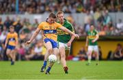 22 June 2014; Clare's Sean Collins scores his side's first point despite pressure from Kerry's Fionn Fitzgerald. Munster GAA Football Senior Championship, Semi-Final, Clare v Kerry, Cusack Park, Ennis, Co. Clare. Picture credit: Ray McManus / SPORTSFILE
