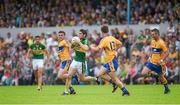 22 June 2014; Killian Young, Kerry, in action against Sean Collins, left, Martin O'Leary, and Enda Coughlan, Clare. Munster GAA Football Senior Championship, Semi-Final, Clare v Kerry, Cusack Park, Ennis, Co. Clare. Picture credit: Ray McManus / SPORTSFILE