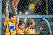 22 June 2014; Clare supporters left to right, Padraic O'Donovan, aged 8, Louis O'Dwyer, aged 5, and his 7 year old brother James, all from Ennis, watch the game. . Munster GAA Football Senior Championship, Semi-Final, Clare v Kerry, Cusack Park, Ennis, Co. Clare. Picture credit: Ray McManus / SPORTSFILE