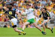 22 June 2014; Patrick McBrearty, Donegal, in action against Michael McCann, left, and Niall Delargy, Antrim. Ulster GAA Football Senior Championship, Semi-Final, Donegal v Antrim, St Tiernach's Park, Clones, Co. Monaghan. Picture credit: Oliver McVeigh / SPORTSFILE