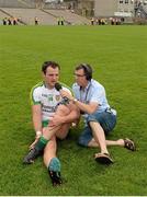 22 June 2014; Donegal's Michael Murphy being interviewed for BBC Radio Ulster by Gerard Tracey during the team warm down after the match. Ulster GAA Football Senior Championship, Semi-Final, Donegal v Antrim, St Tiernach's Park, Clones, Co. Monaghan. Picture credit: Oliver McVeigh / SPORTSFILE