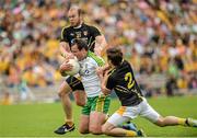 22 June 2014; Michael Murphy, Donegal, in action against Sean McVeigh, top, and Kevin O'Boyle, Antrim. Ulster GAA Football Senior Championship, Semi-Final, Donegal v Antrim, St Tiernach's Park, Clones, Co. Monaghan. Picture credit: Oliver McVeigh / SPORTSFILE