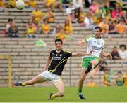 22 June 2014; Odhran MacNiallais, Donegal, in action against Niall McKeever, Antrim. Ulster GAA Football Senior Championship, Semi-Final, Donegal v Antrim, St Tiernach's Park, Clones, Co. Monaghan. Picture credit: Oliver McVeigh / SPORTSFILE