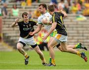 22 June 2014; Eamonn McGee, Donegal, in action against Justin Crozier, left, and Mark Sweeney, Antrim. Ulster GAA Football Senior Championship, Semi-Final, Donegal v Antrim, St Tiernach's Park, Clones, Co. Monaghan. Picture credit: Oliver McVeigh / SPORTSFILE