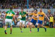 22 June 2014; Killian Young, Kerry, in action against Shane Brennan, and Enda Coughlan, right, Clare. Munster GAA Football Senior Championship, Semi-Final, Clare v Kerry, Cusack Park, Ennis, Co. Clare. Picture credit: Ray McManus / SPORTSFILE