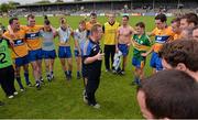 22 June 2014; Clare manager Colm Collins speaking to his players after the game. Munster GAA Football Senior Championship, Semi-Final, Clare v Kerry, Cusack Park, Ennis, Co. Clare. Picture credit: Ray McManus / SPORTSFILE