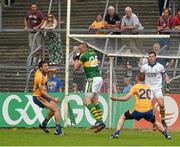 22 June 2014; Kieran Donaghy, Kerry, wins possession ahead of Clare players Gary Brennan and Eoin Cleary in what proved to be the last play of the game. Munster GAA Football Senior Championship, Semi-Final, Clare v Kerry, Cusack Park, Ennis, Co. Clare. Picture credit: Ray McManus / SPORTSFILE