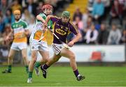 25 June 2014; Aidan Nolan, Wexford, in action against Con Mahon, Offaly. Bord Gáis Energy Leinster GAA Hurling Under 21 Championship, Semi-Final, Wexford v Offaly, Wexford Park, Wexford. Picture credit: Matt Browne / SPORTSFILE