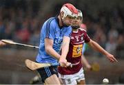 25 June 2014; Colm Cronin, Dublin, shoots to score his side's opening goal of the game despite the attempts of Gary Greville, Westmeath. Bord Gáis Energy Leinster GAA Hurling Under 21 Championship, Semi-Final, Westmeath v Dublin, Cusack Park, Mullingar, Co. Westmeath. Picture credit: Barry Cregg / SPORTSFILE