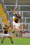 25 June 2014; Jack Guiney, Wexford, in action against Jason Sampson, Offaly. Bord Gáis Energy Leinster GAA Hurling Under 21 Championship, Semi-Final, Wexford v Offaly, Wexford Park, Wexford. Picture credit: Matt Browne / SPORTSFILE