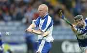 8 July 2006; John Mullane, Waterford, scores his side's first goal despite the attentions of John Walsh, Laois. Guinness All-Ireland Senior Hurling Championship Qualifier, Round 3, Laois v Waterford, O'Moore Park, Portlaoise, Co. Laois. Picture credit: Brendan Moran / SPORTSFILE