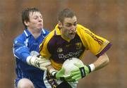 8 July 2006; Matty Forde, Wexford, is tackled by Shane Duffy, Monaghan. Bank of Ireland All-Ireland Senior Football Championship Qualifier, Round 2, Monaghan v Wexford, St. Tighearnach's Park, Clones, Co. Monaghan. Picture credit: David Maher / SPORTSFILE