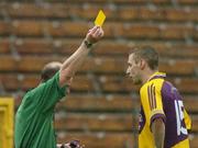 8 July 2006; Matty Forde, Wexford, is shown the yellow card from referee Frank Flynn during the first half. Bank of Ireland All-Ireland Senior Football Championship Qualifier, Round 2, Monaghan v Wexford, St. Tighearnach's Park, Clones, Co. Monaghan. Picture credit: David Maher / SPORTSFILE