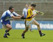 8 July 2006; Ciaran Deely, Wexford, is tackled by Damien Freeman, Monaghan. Bank of Ireland All-Ireland Senior Football Championship Qualifier, Round 2, Monaghan v Wexford, St. Tighearnach's Park, Clones, Co. Monaghan. Picture credit: David Maher / SPORTSFILE