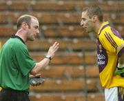 8 July 2006; Matty Forde, Wexford, remonstrates with referee Frank Flynn before he was shown the yellow card. Bank of Ireland All-Ireland Senior Football Championship Qualifier, Round 2, Monaghan v Wexford, St. Tighearnach's Park, Clones, Co. Monaghan. Picture credit: David Maher / SPORTSFILE