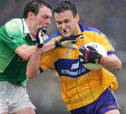 8 July 2006; Peter O'Dwyer, Clare, is tackled by James Sherry, Fermanagh. Bank of Ireland All-Ireland Senior Football Championship Qualifier, Round 2, Clare v Fermanagh, Cusack Park, Ennis, Co. Clare. Picture credit: Kieran Clancy / SPORTSFILE