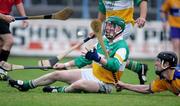 8 July 2006; Declan Tanner, Offaly. hand passes under pressure from Clare's Niall Gilligan. Guinness All-Ireland Senior Hurling Championship Qualifier, Round 3, Clare v Offaly, Cusack Park, Ennis, Co. Clare. Picture credit: Kieran Clancy / SPORTSFILE