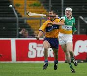 8 July 2006; Brian O'Connell, Clare, in action against Brian Whelahan, Offaly. Guinness All-Ireland Senior Hurling Championship Qualifier, Round 3, Clare v Offaly, Cusack Park, Ennis, Co. Clare. Picture credit: Kieran Clancy / SPORTSFILE