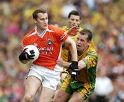 9 July 2006; John McEntee, Armagh, in action against Christy Toye, Donegal. Bank of Ireland Ulster Senior Football Championship Final, Donegal v Armagh, Croke Park, Dublin. Picture credit: Ray McManus / SPORTSFILE