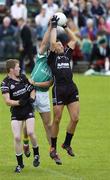 9 July 2006; Eamonn O'Hara, Sligo, catches the throw in to start the match ahead of Christopher Carroll supported by team-mate Tony Taylor, Leitrim. Bank of Ireland All-Ireland Senior Football Championship Qualifier, Round 2, Leitrim v Sligo, Sean McDiarmuid Park, Carrick-on-Shannon, Co. Leitrim. Picture credit: Damien Eagers / SPORTSFILE