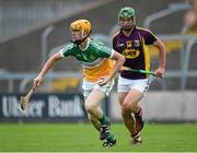 25 June 2014; Simon Og Lyons, Offaly, in action against Conor McDonald, Wexford. Bord Gáis Energy Leinster GAA Hurling Under 21 Championship, Semi-Final, Wexford v Offaly, Wexford Park, Wexford. Picture credit: Matt Browne / SPORTSFILE