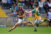 25 June 2014; Conor McDonald, Wexford, in action against Niall Wynne, Offaly. Bord Gáis Energy Leinster GAA Hurling Under 21 Championship, Semi-Final, Wexford v Offaly, Wexford Park, Wexford. Picture credit: Matt Browne / SPORTSFILE