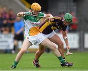 25 June 2014; Conor McDonald, Wexford, in action against Simon Og Lyons, Offaly. Bord Gáis Energy Leinster GAA Hurling Under 21 Championship, Semi-Final, Wexford v Offaly, Wexford Park, Wexford. Picture credit: Matt Browne / SPORTSFILE