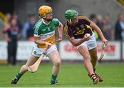 25 June 2014; Conor McDonald, Wexford, in action against Simon Og Lyons, Offaly. Bord Gáis Energy Leinster GAA Hurling Under 21 Championship, Semi-Final, Wexford v Offaly, Wexford Park, Wexford. Picture credit: Matt Browne / SPORTSFILE