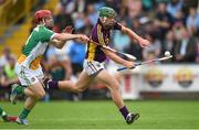 25 June 2014; Aidan Nolan, Wexford, in action against Con Mahon, Offaly. Bord Gáis Energy Leinster GAA Hurling Under 21 Championship, Semi-Final, Wexford v Offaly, Wexford Park, Wexford. Picture credit: Matt Browne / SPORTSFILE