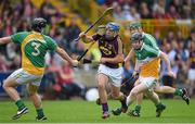 25 June 2014; Garry Moore, Wexford, in action against Dan Kelleher, 3, and Niall Wynne, Offaly. Bord Gáis Energy Leinster GAA Hurling Under 21 Championship, Semi-Final, Wexford v Offaly, Wexford Park, Wexford. Picture credit: Matt Browne / SPORTSFILE