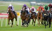 27 June 2014: Woods, centre, with Joseph O'Brien up, on their way to winning the Tom Crean's Irish Lager European Breeders Fund Fillies Maiden from Curlylocks, left, with Wayne Lordan up, who finished third, and Raydara, with Shane Foley up, who finished second. Curragh Racecourse, The Curragh, Co. Kildare. Picture credit: Barry Cregg / SPORTSFILE