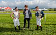 27 June 2014: Jockeys Wayne Lordan, left, and Leigh Roche are interviewed by Hector O hEochagain after winning the Paddy Power Zorb Derby in aid of the Jack and Jill Children's Foundation. Curragh Racecourse, The Curragh, Co. Kildare. Picture credit: Barry Cregg / SPORTSFILE