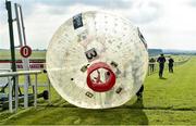 27 June 2014: Jockeys Wayne Lordan being pushed by team-mate Leigh Roche, on their way to winning the Paddy Power Zorb Derby in aid of the Jack and Jill Children's Foundation. Curragh Racecourse, The Curragh, Co. Kildare. Picture credit: Barry Cregg / SPORTSFILE