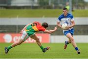 28 June 2014; Paul Whyte, Waterford, in action against Daniel St Ledger, Carlow. GAA Football All Ireland Senior Championship, Round 1B, Carlow v Waterford, Dr. Cullen Park, Carlow. Picture credit: Piaras Ó Mídheach / SPORTSFILE