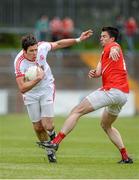 28 June 2014; Sean Cavanagh, Tyrone, in action against Brian White, Louth. GAA Football All Ireland Senior Championship, Round 1B, Tyrone v Louth, Healy Park, Omagh, Co. Tyrone. Picture credit: Oliver McVeigh / SPORTSFILE