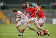 28 June 2014; Sean Cavanagh, Tyrone, in action against Brian White and Mick Fanning, Louth. GAA Football All Ireland Senior Championship, Round 1B, Tyrone v Louth, Healy Park, Omagh, Co. Tyrone. Picture credit: Oliver McVeigh / SPORTSFILE
