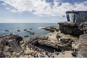 28 June 2014; Matt Cowen dives from the 28 metre platform during the seeding round of the third stop of the Red Bull Cliff Diving World Series. Inis Mor, Aran Islands, Co. Galway. Picture credit: Romina Amato / SPORTSFILE