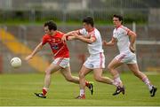 28 June 2014; Colm Judge, Louth, in action against Darren McCurry, Tyrone. GAA Football All Ireland Senior Championship, Round 1B, Tyrone v Louth, Healy Park, Omagh, Co. Tyrone. Picture credit: Oliver McVeigh / SPORTSFILE