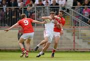 28 June 2014; Shea McGuigan, Tyrone, in action against Mick Fanning and Derick Crilly, Louth. GAA Football All Ireland Senior Championship, Round 1B, Tyrone v Louth, Healy Park, Omagh, Co. Tyrone. Picture credit: Oliver McVeigh / SPORTSFILE