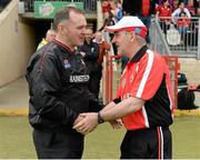 28 June 2014; Louth manager Aidan O'Rourke, left, and Tyrone manager Mickey Harte exchange handshakes after the final whistle. GAA Football All Ireland Senior Championship, Round 1B, Tyrone v Louth, Healy Park, Omagh, Co. Tyrone. Picture credit: Oliver McVeigh / SPORTSFILE