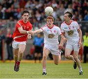 28 June 2014; Derek Maguire, Louth, in action against Peter Harte and Colm Cavanagh, Tyrone. GAA Football All Ireland Senior Championship, Round 1B, Tyrone v Louth, Healy Park, Omagh, Co. Tyrone. Picture credit: Oliver McVeigh / SPORTSFILE