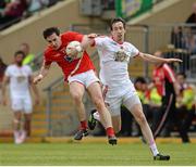 28 June 2014; Derek Maguire, Louth, in action against Colm Cavanagh, Tyrone. GAA Football All Ireland Senior Championship, Round 1B, Tyrone v Louth, Healy Park, Omagh, Co. Tyrone. Picture credit: Oliver McVeigh / SPORTSFILE