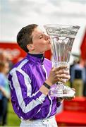 28 June 2014: Jockey Joseph O'Brien with the trophy after winning the Dubai Duty Free Irish Derby on Australia. Curragh Racecourse, The Curragh, Co. Kildare. Picture credit: Barry Cregg / SPORTSFILE