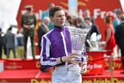 28 June 2014: Jockey Joseph O'Brien with the trophy after winning the Dubai Duty Free Irish Derby on Australia. Curragh Racecourse, The Curragh, Co. Kildare. Picture credit: Barry Cregg / SPORTSFILE