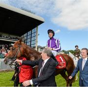 28 June 2014: Australia, with Joseph O'Brien up, being led to the winners enclosure after winning the Dubai Duty Free Irish Derby. Curragh Racecourse, The Curragh, Co. Kildare. Picture credit: Barry Cregg / SPORTSFILE