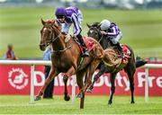28 June 2014: Australia, with Joseph O'Brien up, pull away from Kingfisher, with Colm O'Donoghue up, on their way to winning the Dubai Duty Free Irish Derby. Curragh Racecourse, The Curragh, Co. Kildare. Picture credit: Barry Cregg / SPORTSFILE