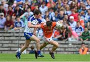 28 June 2014; Caolan McConville, Armagh, in action against Caolan McElwain, Monaghan. Electric Ireland Ulster GAA Football Minor Championship Semi-Final, St Tiernach's Park, Clones, Co. Monaghan. Picture credit: Ramsey Cardy / SPORTSFILE